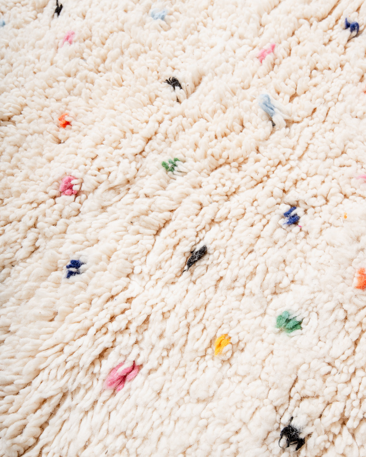 Modern, designer, handcrafted Berber rug from Morocco. Beniourain carpet with beautiful colours and patterns and fluffy wool texture.